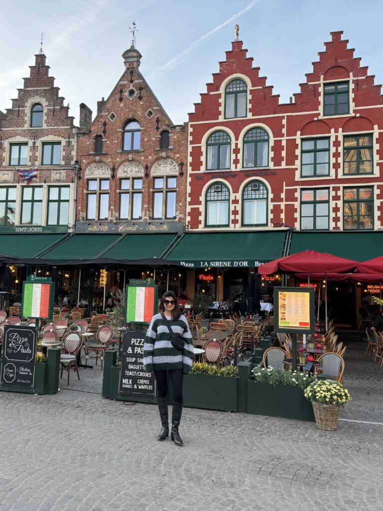 woman taking a picture of a building