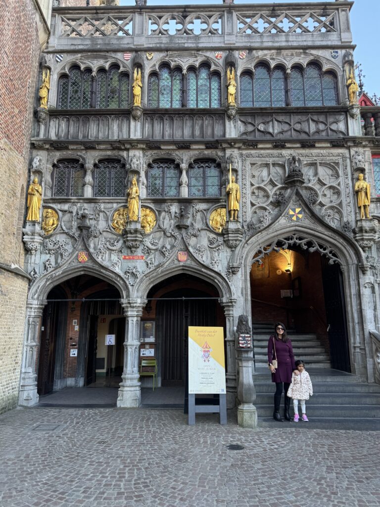 daughter and wife taking a picture of a building