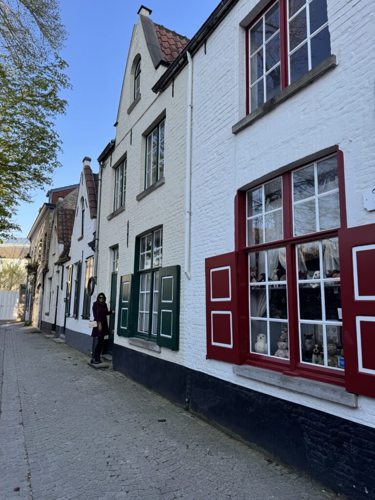 A building featuring vibrant red and green shutters, showcasing a charming and colorful architectural style.