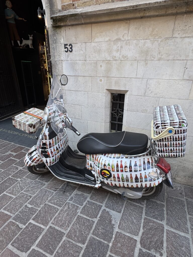 A motorcycle loaded with various items, showcasing a mix of gear and supplies attached to it.