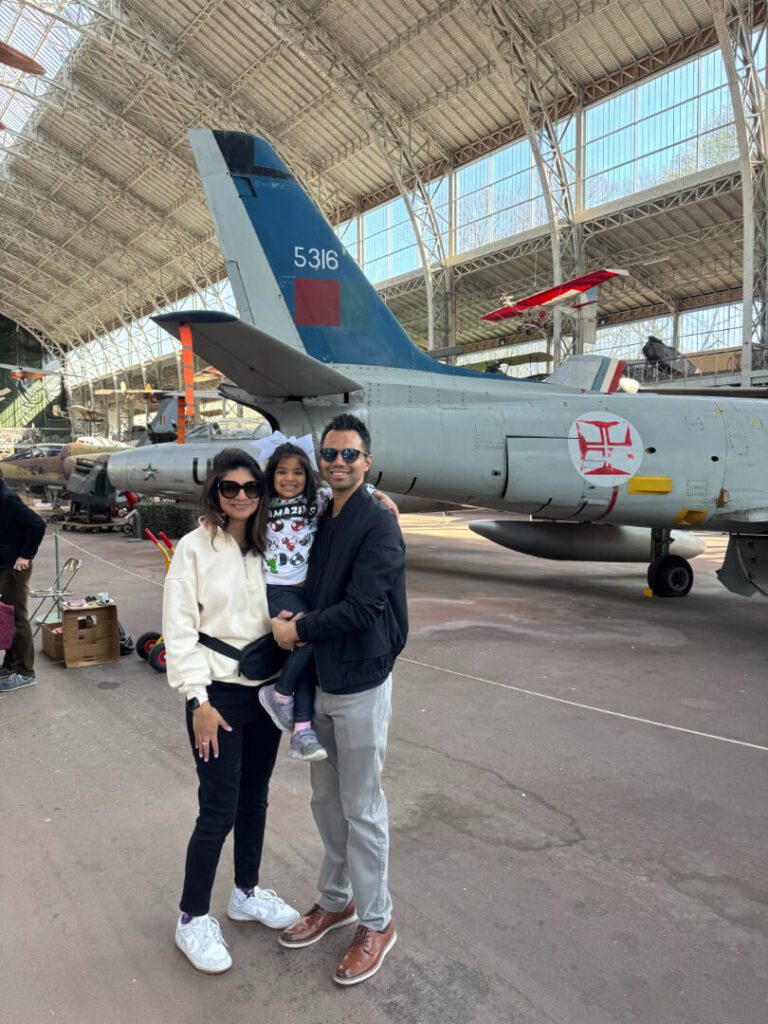 Family taking a picture in an aircraft museum